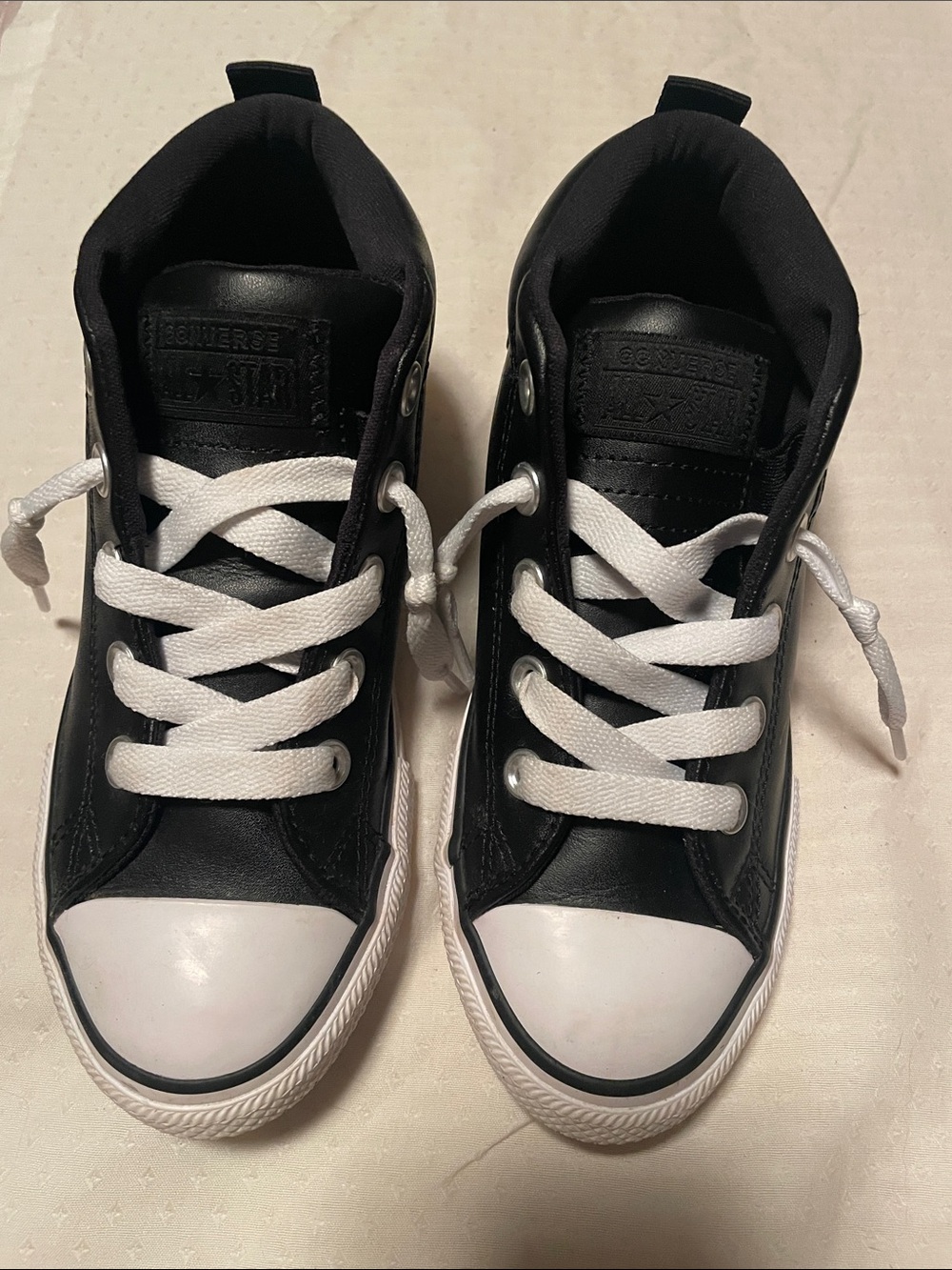 Converse Kids Black High-Top Sneakers with White Accents. Leather look.